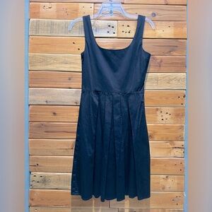 Black dress with tank top straps. Pleated skirt. Size 8/10